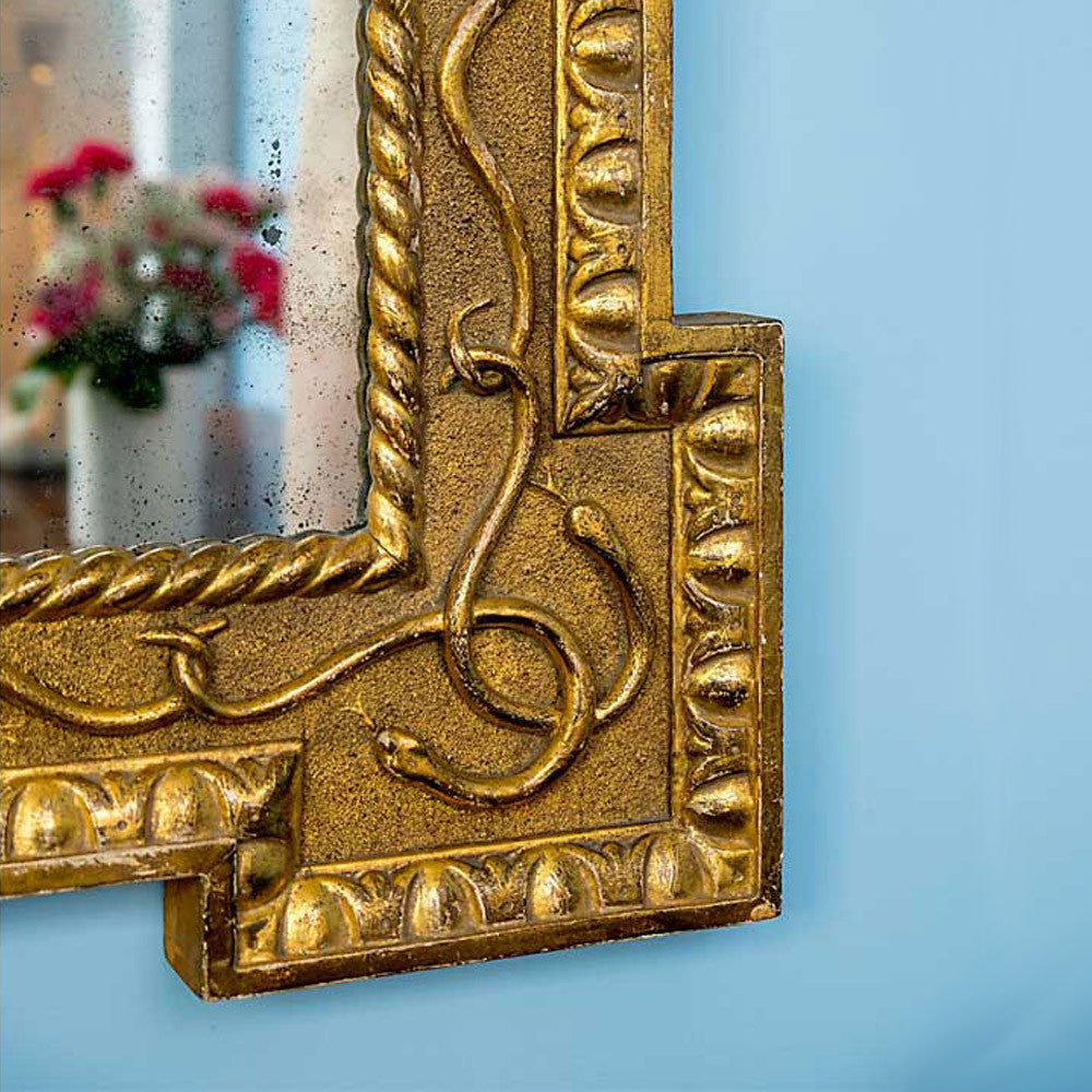 Carved and gilt serpent mirror