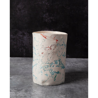 Cylindrical porcelain ceramic vase with abstract designs  using honesty seed heads, lavender, grasses and olive leaves in a dark background