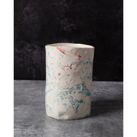 Cylindrical porcelain ceramic vase with abstract designs  using honesty seed heads, lavender, grasses and olive leaves in a dark background