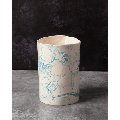 Ceramic vase with floral patterns on a dark background