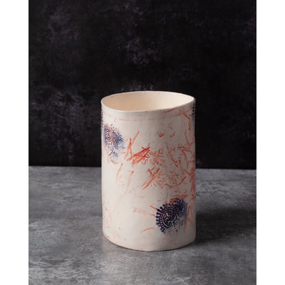 Ceramic vase with abstract patterns on a dark background