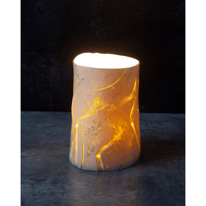 Decorative night light / vase with gold marbling on a dark background