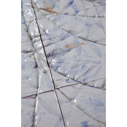 Detail of Large porcelain tile panel of an olive tree. Looking at leaves and branches. Blue and browny green colours on a white background