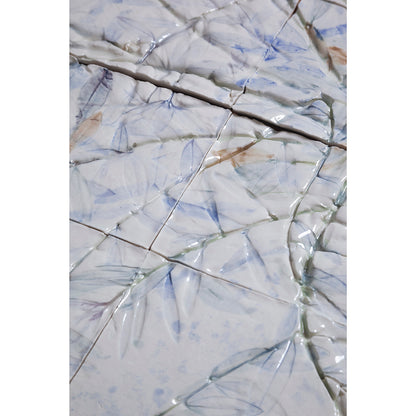 Detail of Large porcelain tile panel of an olive tree. Looking at leaves and branches. Blue, beige and green colors on a white background