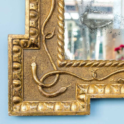 Carved and gilt serpent mirror